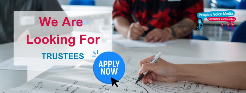 Text reading 'We are looking for trustees - apply now' On a background image of a group sat around a table writing on a large piece of paper.